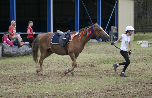 girl running with horse